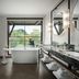 Grand Bohemian Lodge Greenville, Autograph Collection bathroom with soaking tub, marble vanity and forest view