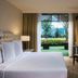 Marquis Reforma, Mexico City guest room with king bed, patio doors, and garden view