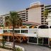 La Concha Resort, Puerto Rico, Autograph Collection in San Juan with palm trees and oceanfront facade