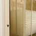 Saint Lawrence Residences and Suites Toronto bathroom with glass shower enclosure and toilet