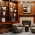 Club Quarters Hotel Faneuil Hall, Boston lobby lounge with fireplace and two gray chairs