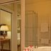 Residenza Paolo VI Rome bathroom with double sink, glass shower and towel warmer