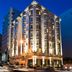 Staypineapple, An Elegant Hotel, Union Square in San Francisco, illuminated corner hotel exterior at dusk