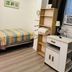 Saint Lawrence Residences and Suites Toronto room with single bed, desk, shelving, and window