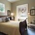 The College Club of Boston guest room in Boston with a four-poster bed, sitting chair, and window view