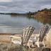 Carolyn Beach Inn in Thessalon with lakeside chairs overlooking a calm waterfront