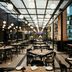 Marquis Reforma Mexico City restaurant interior with black tables, chairs, and globe pendant lights