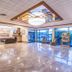 Ramada by Wyndham Thunder Bay Airlane Hotel lobby with glossy floors and glass entry in Thunder Bay