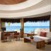 Melia Cozumel lobby lounge with ocean views, desks, and seating overlooking the beach