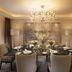 Kempinski Hotel Beijing Yansha Center dining room in Beijing with chandelier and set table