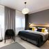 Original Sokos Hotel Lappee room in Lappeenranta with bed, chairs, and large windows