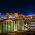 The Orleans Hotel & Casino in Las Vegas with illuminated city skyline and casino buildings at night