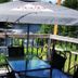Petawawa River Inn & Suites in Petawawa patio table with umbrella overlooking the river