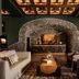 Grand Bohemian Lodge Greenville, Autograph Collection lobby with stone arch, fireplace, and seating