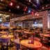 The Orleans Hotel & Casino Las Vegas restaurant and bar with tables, stools, and colorful ceiling lights