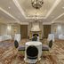 Best Western Plus Stoneridge Inn & Conference Centre London conference room with fireplace and round tables