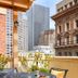 Orchard Garden Hotel San Francisco terrace with table, chairs and city skyline view