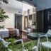 Del Pilar Miraflores Hotel Lima patio with glass table, chairs and bedroom visible through sliding doors
