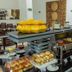 Buffet breakfast setup at Luxor Soft Hotel Teresina in Teresina with pastries, fruit and hot dishes