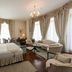 Park International Hotel London bedroom with chaise lounge, seating area and large windows