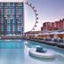 The LINQ Hotel & Casino in Las Vegas pool deck with cabanas and a Ferris wheel view