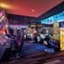 The LINQ Hotel & Casino in Las Vegas casino floor with colorful slot machines and neon lighting