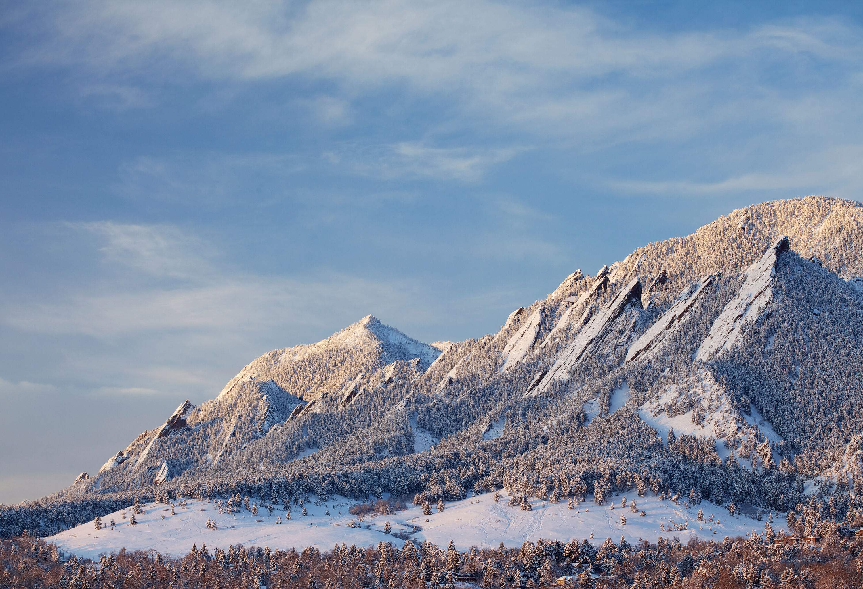 Jagged mountains with sharp peaks covered in snow.