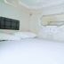 Hostel Space Capsule in Madrid capsule-style bed pod with white futuristic interior and wall mirror