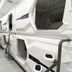 Hostel Space Capsule Madrid: modern capsule bunk pods in a narrow shared hostel dorm
