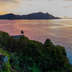 Royal Davui Island overwater villas on Beqa Island with sunset ocean views and lush hillside setting